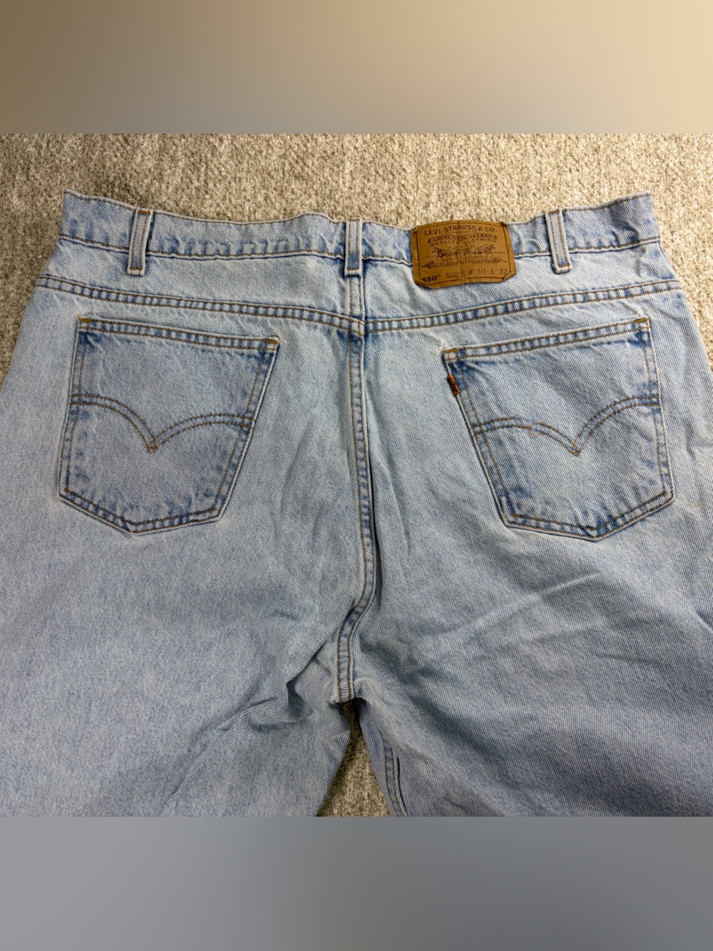 1990’s vintage Levi's 550 jeans in a light wash with rare Orange tag